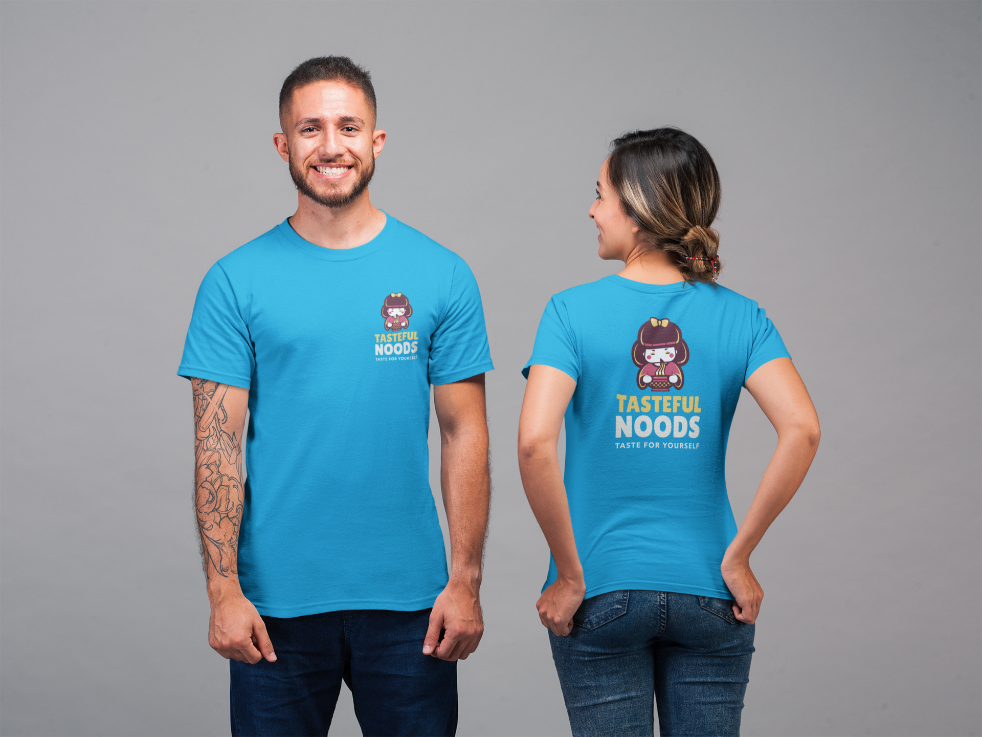 A happy man and woman posing with their custom shirt printed by daylight burnout